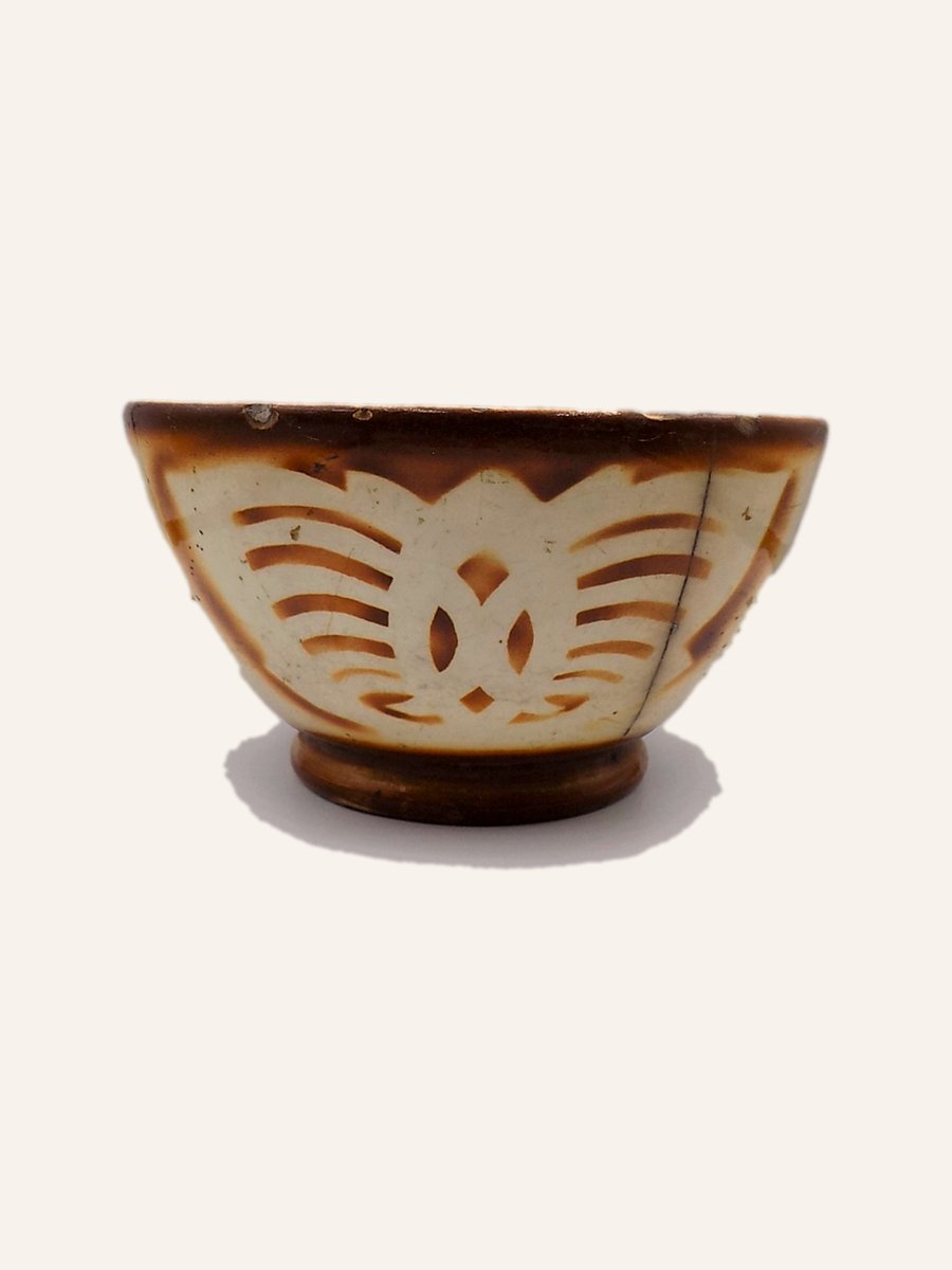 Antique bowl with amber glaze