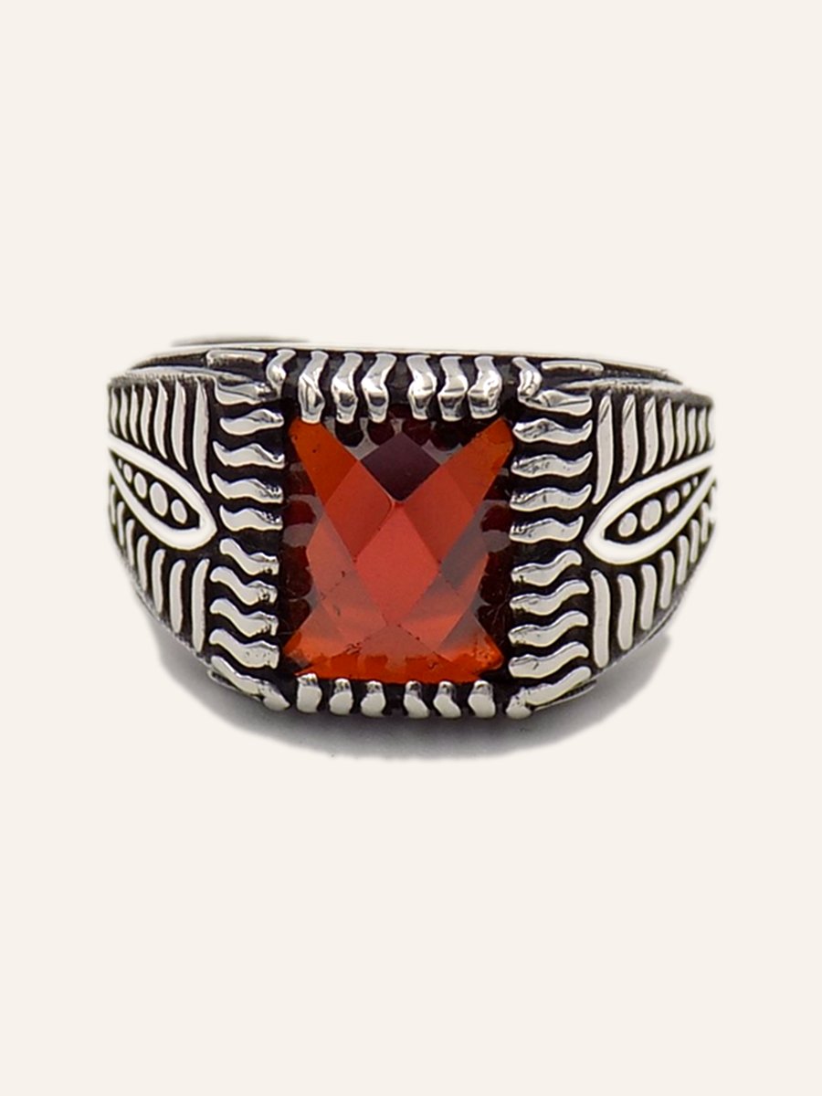 Ring with red cubic zirconia and engraved chevrons