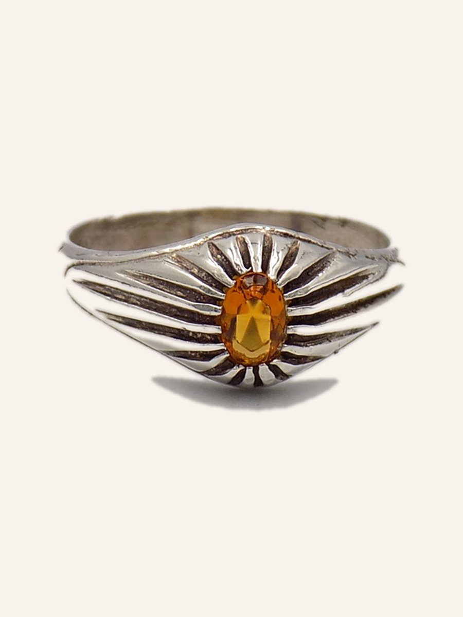 Ring with oval citrine and wing-shaped shoulders