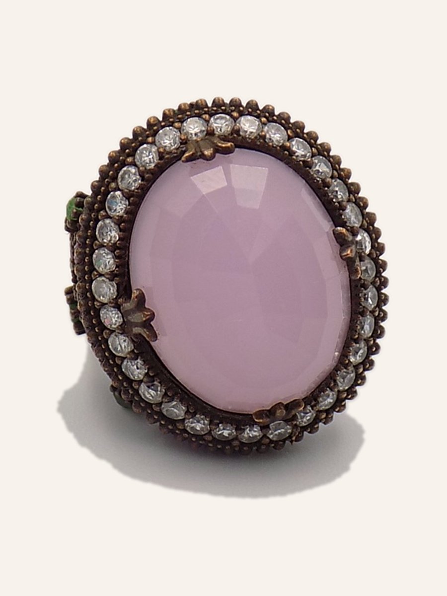 Pink oval ring with halo