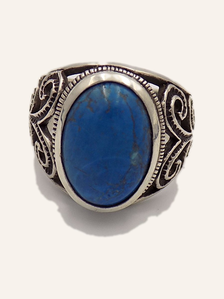 Men's ring with blue cabochon and openwork scrolls