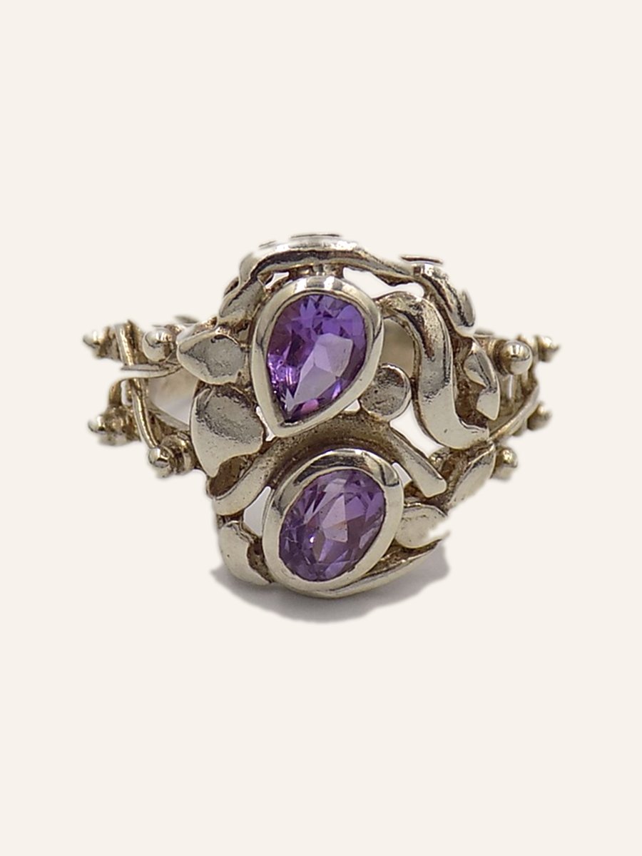 Ring with pear-cut amethysts on an openwork setting