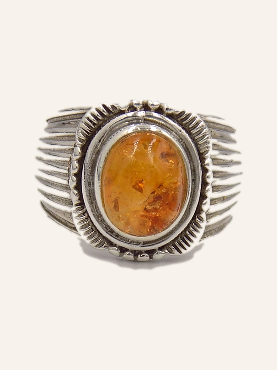 Ring with oval amber and gadrooned shoulders
