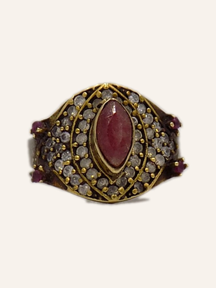 Marquise ring with red stone on a gilt setting