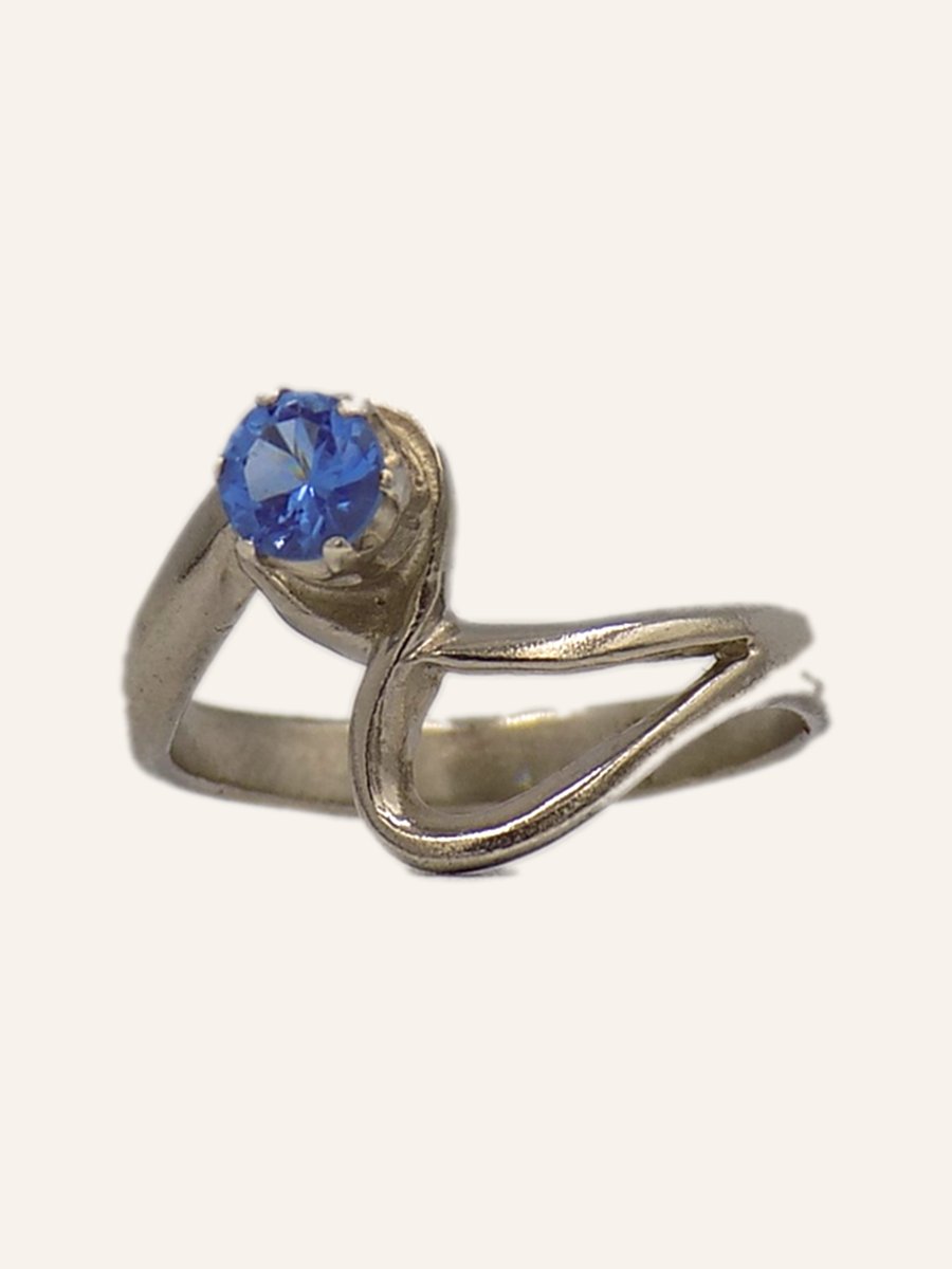 Contemporary ring with blue cubic zirconia
