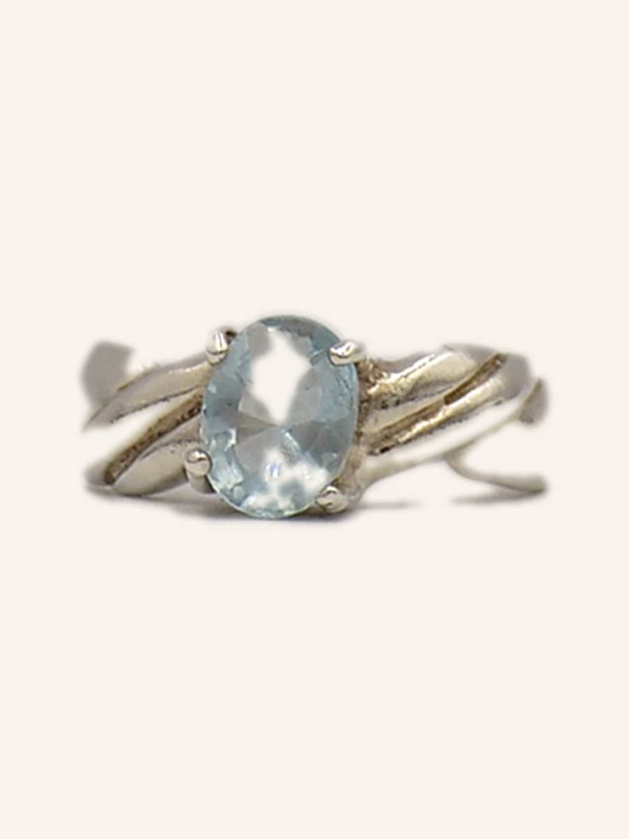 Ring with blue topaz on a twisted band