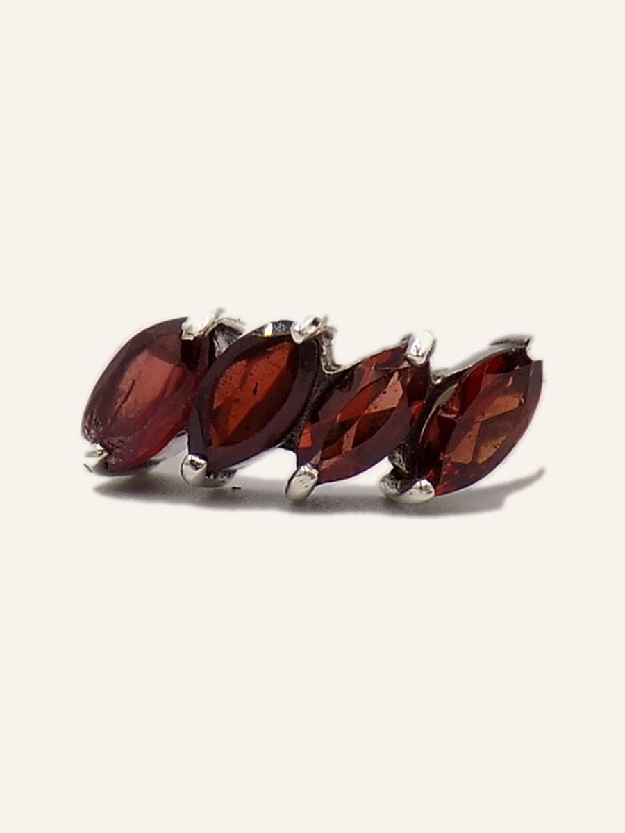 Ring with four marquise-cut garnets