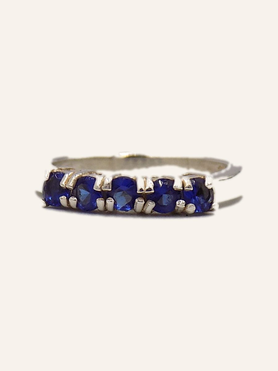 Wedding band with blue stones