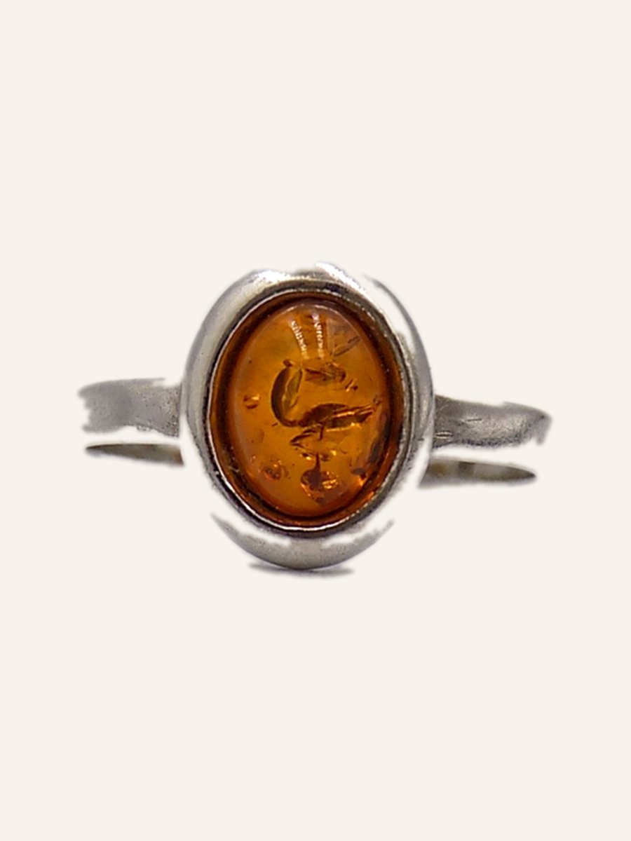 Ring with bezel-set oval amber