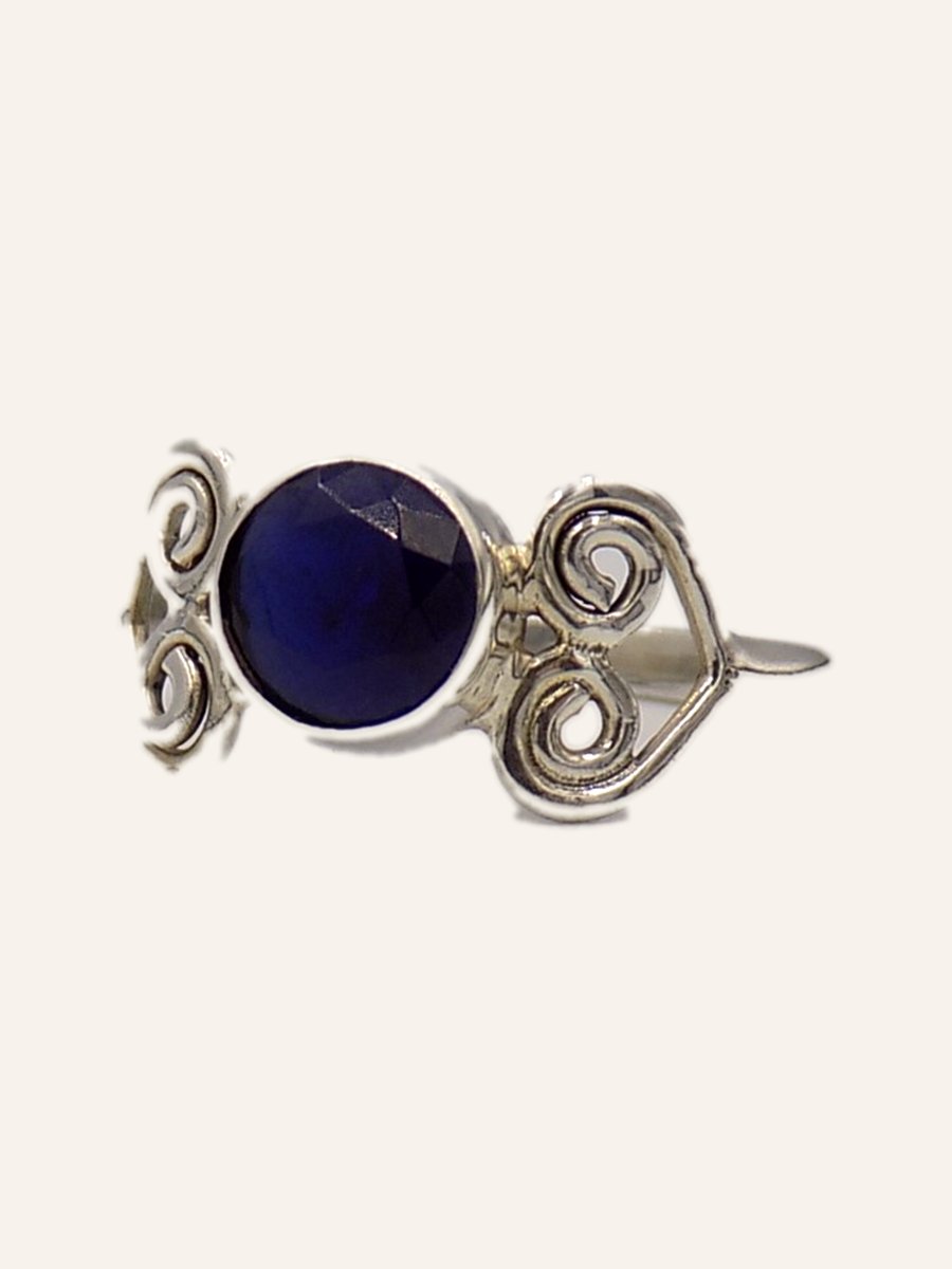 Ring with blue stone and filigree scrolls
