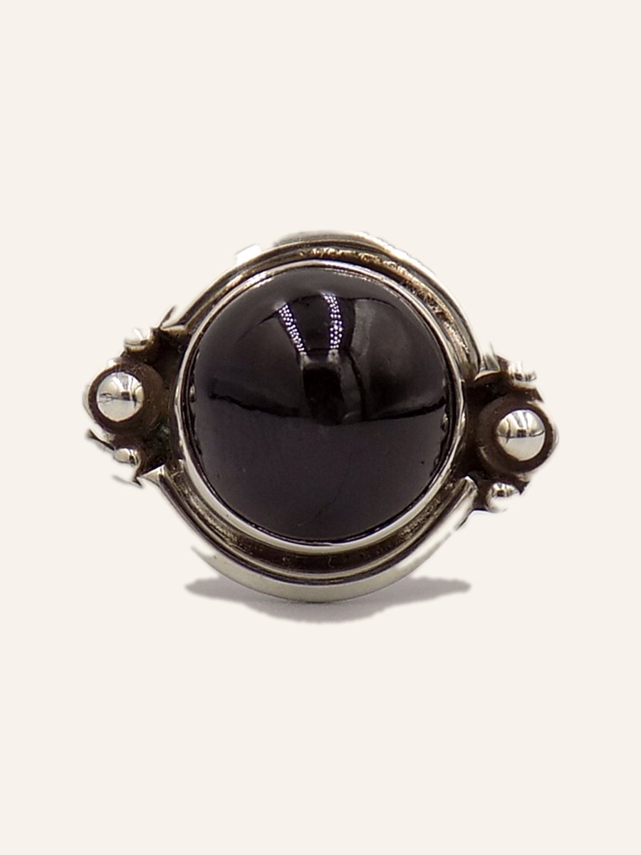 Ring with round onyx and beaded claws