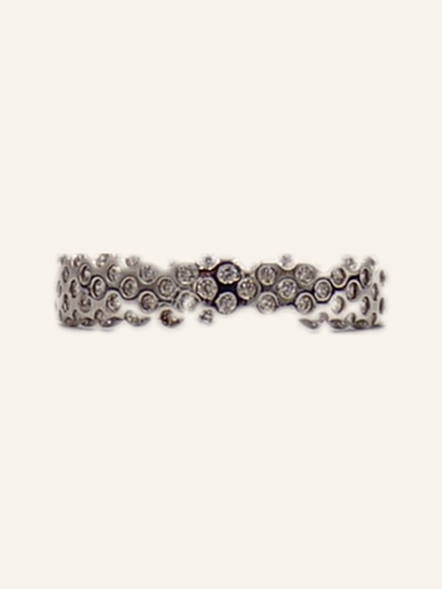 Scalloped wedding band with cubic zirconia