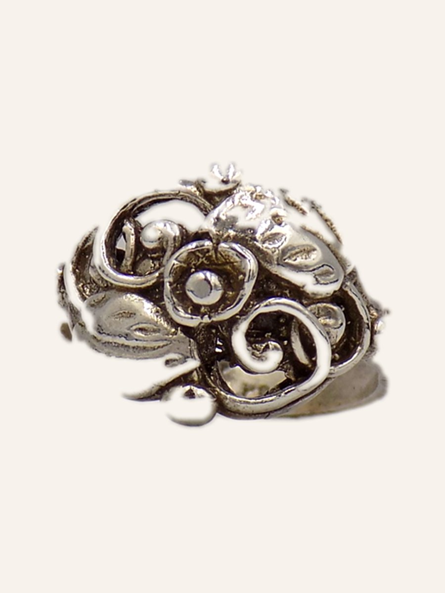 Ring with scrolls and raised beads