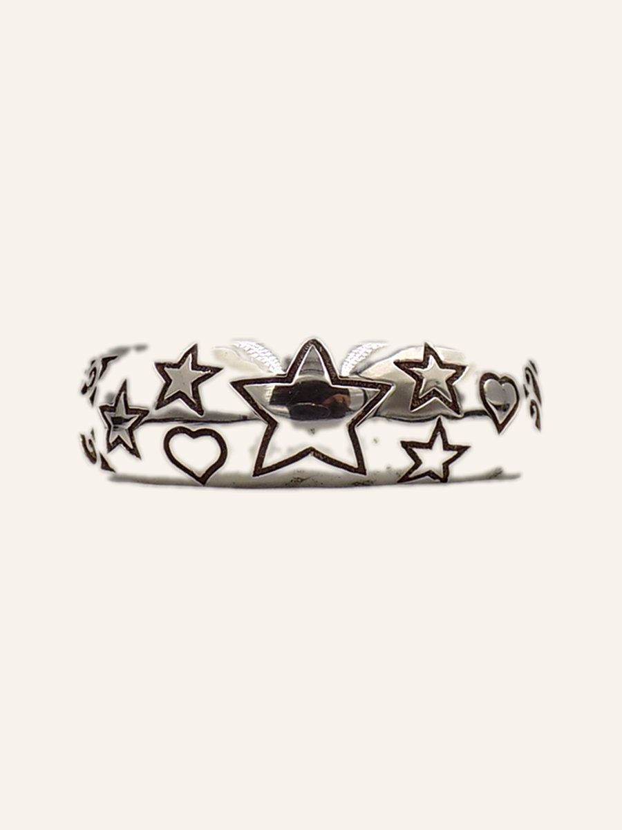 Bangle with engraved stars and hearts