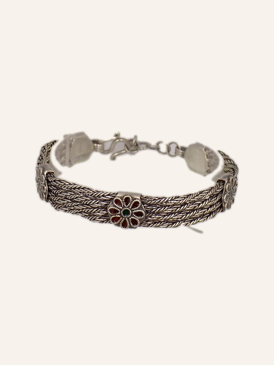 Bracelet with multiple chains and a flower