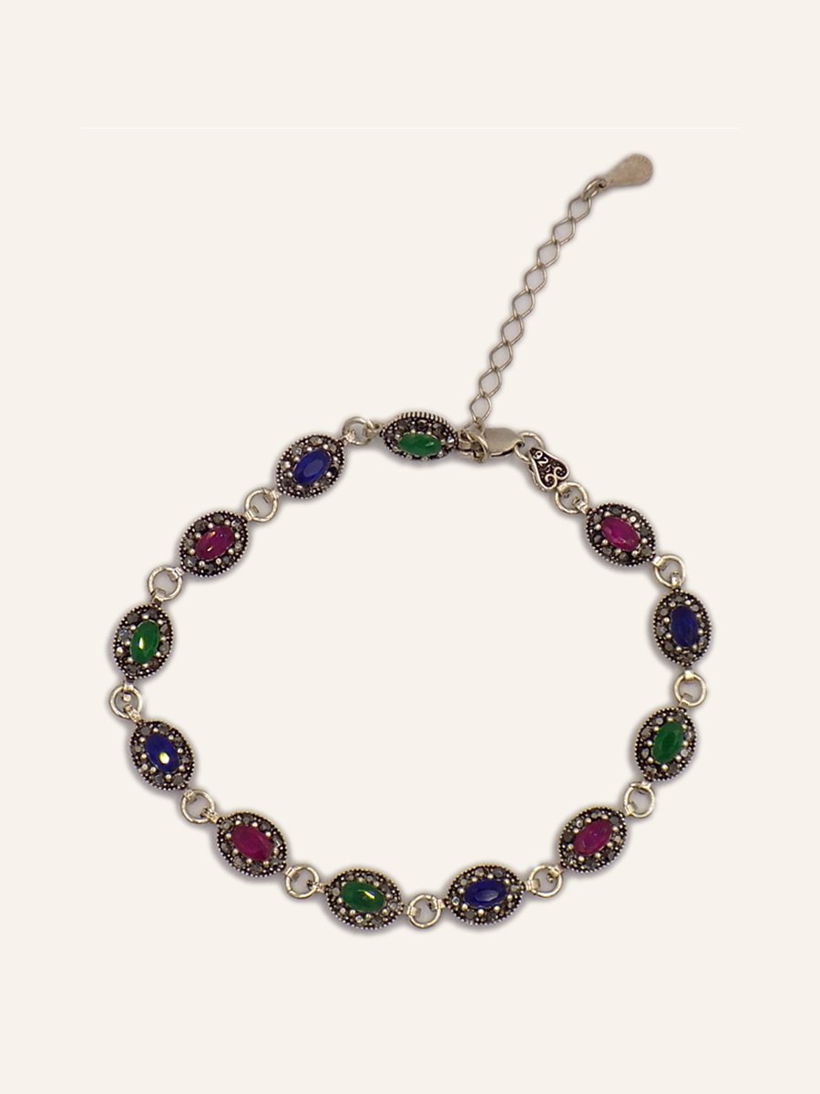 Bracelet with red and green cabochons