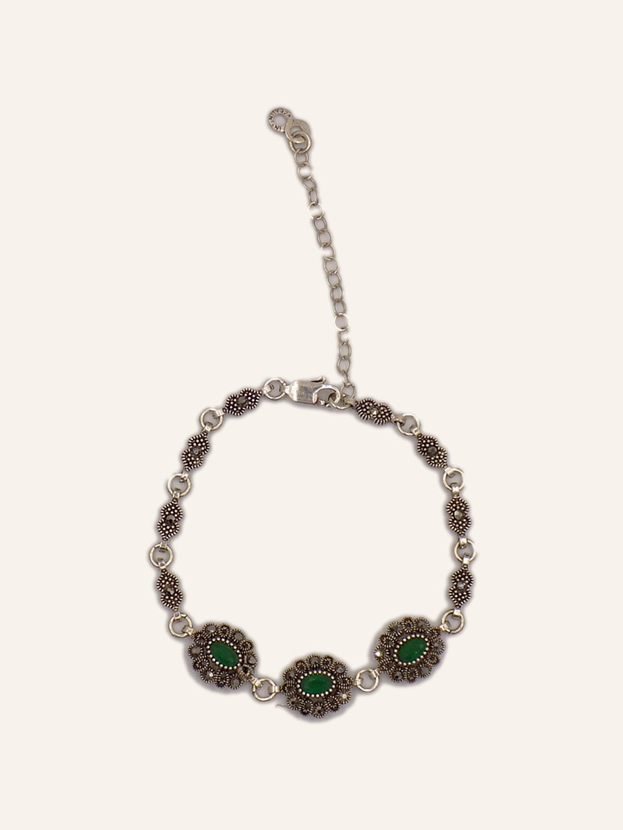 Bracelet with green cabochons