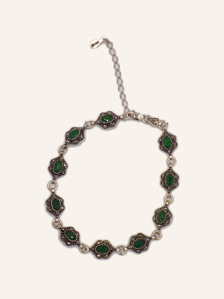 Bracelet with green cabochons and florets