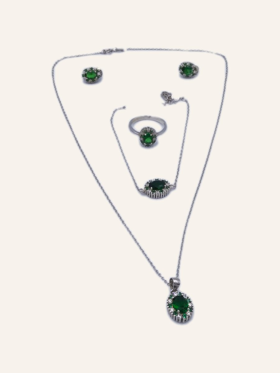 Set with green stones