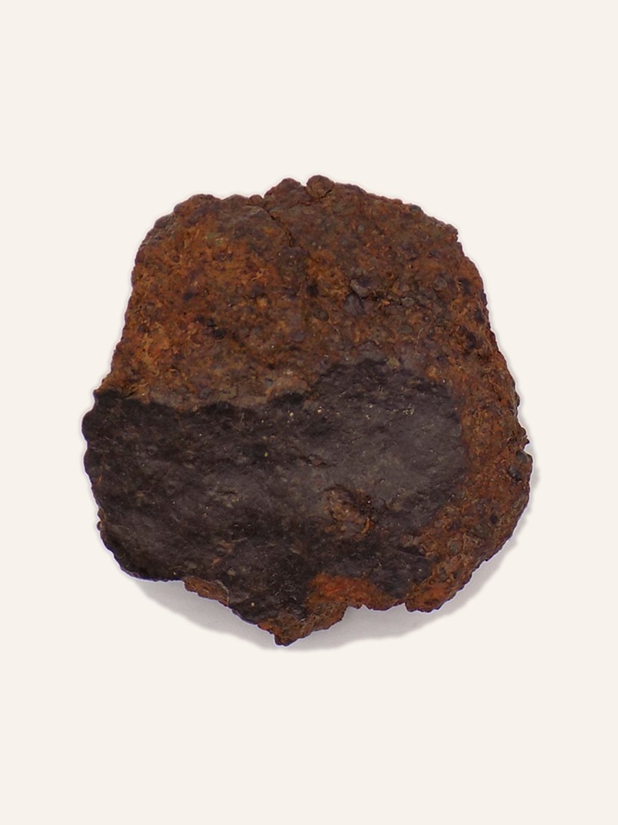 Unclassified meteorite, oxidised surface